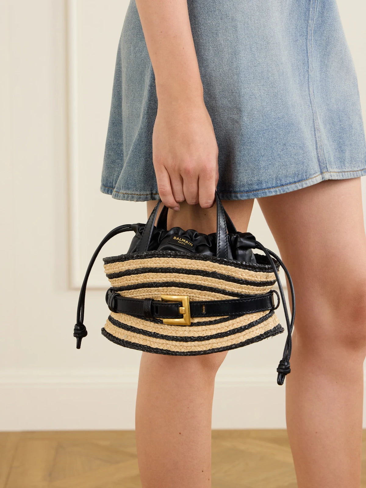 Image of Bags. Product name - Shuffle Mini Buckled Leather-trimmed Raffia Shoulder Bag in Black colour by brand - Balmain