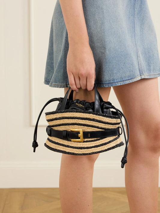 Image of Bags. Product name - Shuffle Mini Buckled Leather-trimmed Raffia Shoulder Bag in Black colour by brand - Balmain