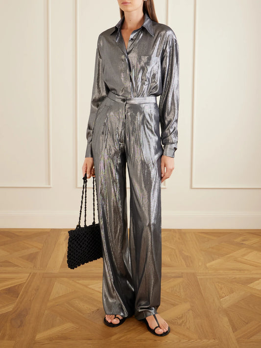 Image of a model wearing Pants. Product name - The Elsa Pleated Lamé Wide-leg Trousers in Silver colour by brand - Giuliva Heritage