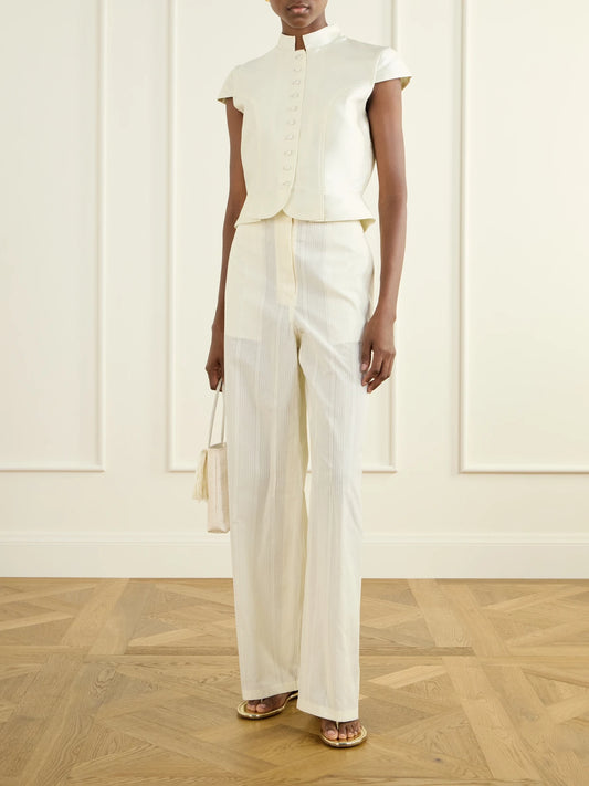Image of a model wearing Tops. Product name - Amoako Summer Satin Blouse in White colour by brand - DESTREE