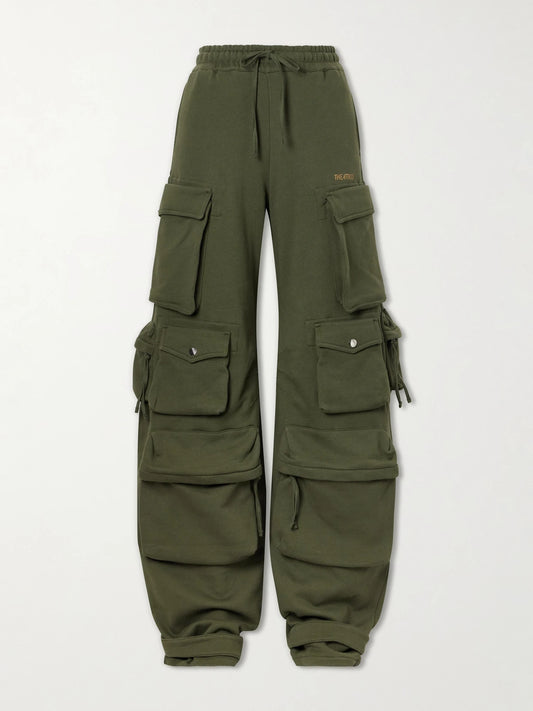 Image of a model wearing Pants. Product name - Cotton Tapered Cargo Pants in Green colour by brand - The Attico