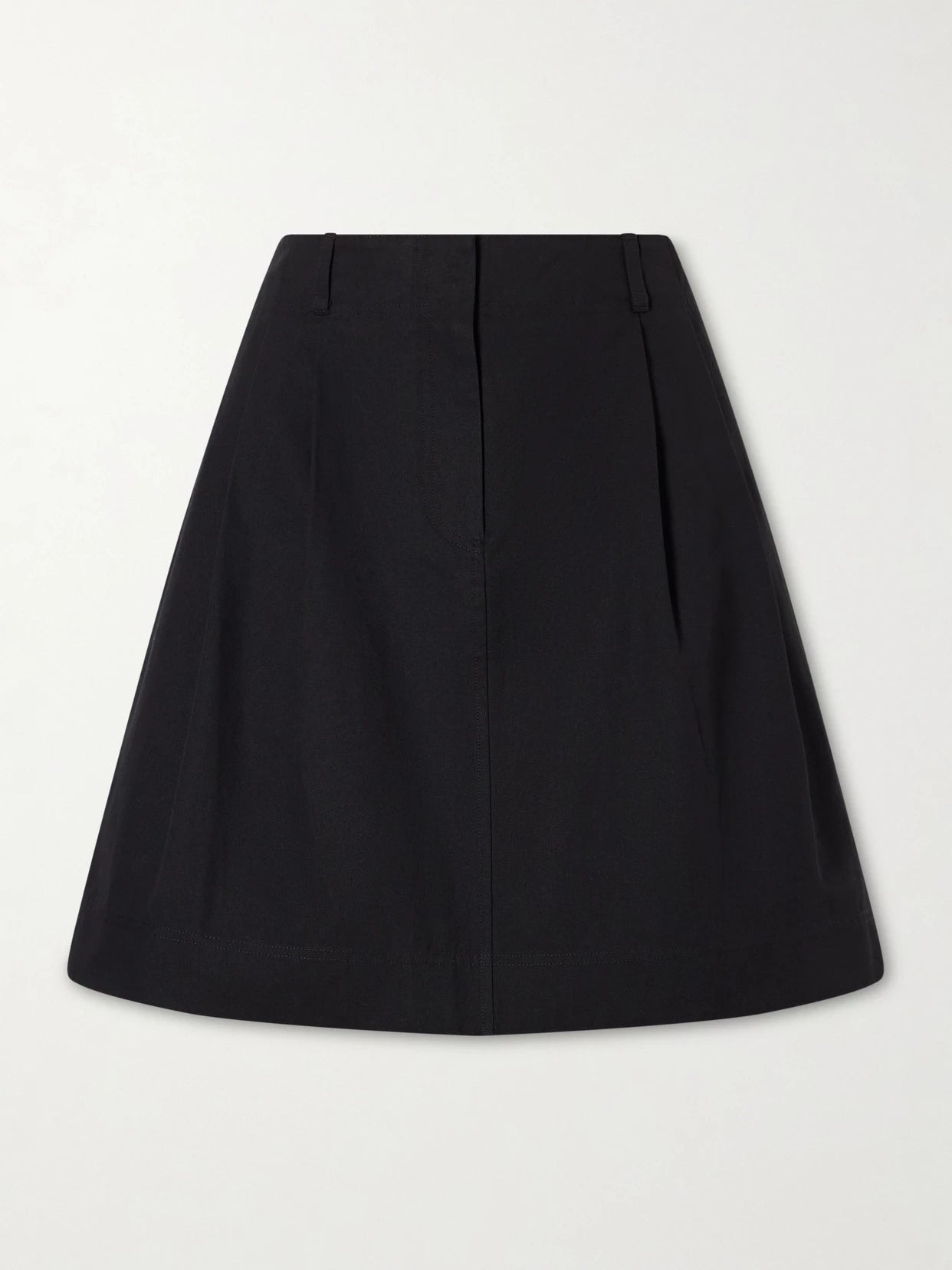 Image of a model wearing Skirts. Product name - Cotton And Lyocell-blend Mini Skirt in Black colour by brand - TOTEME