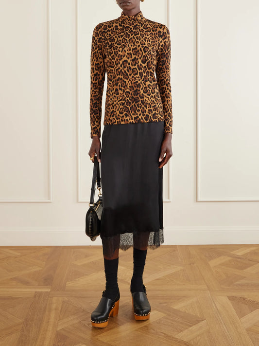 Image of a model wearing Outerwear. Product name - Leopard-print Turtleneck Sweater in Leopard print colour by brand - Anna Sui