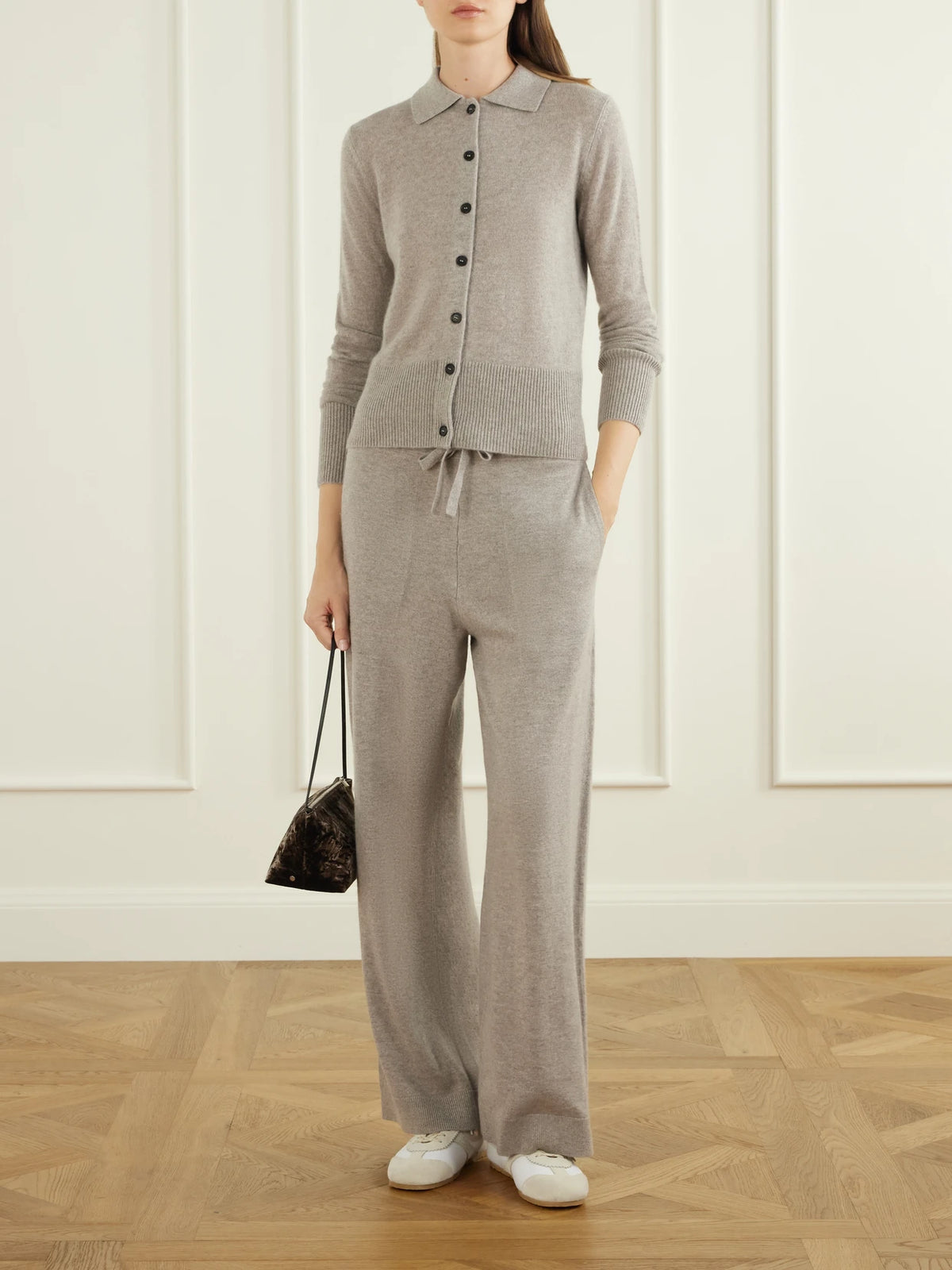 Image of a model wearing Pants. Product name - Suria Ribbed Organic Cashmere Wide-leg Pants in Taupe, Dark purple colour by brand - Le Kasha