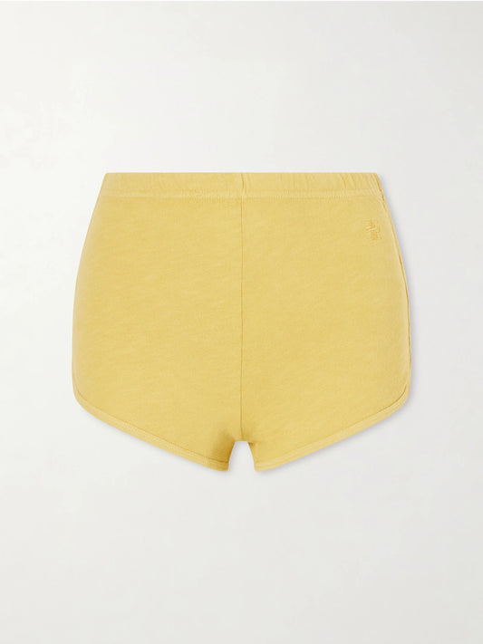 Image of a model wearing Shorts. Product name - Cotton-jersey Shorts in Yellow colour by brand - ÉTERNE