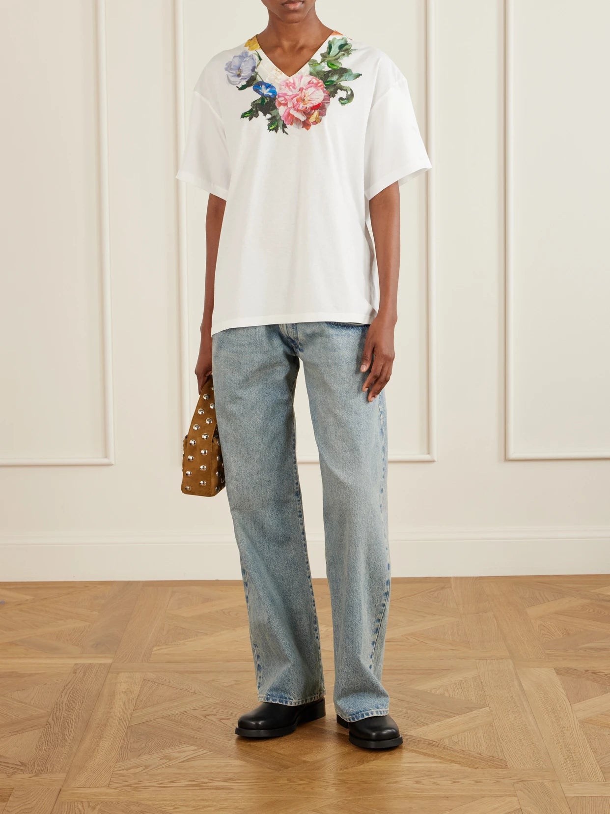 Image of a model wearing Tops. Product name - Floral-print Cotton-jersey T-shirt in White colour by brand - Maison Margiela