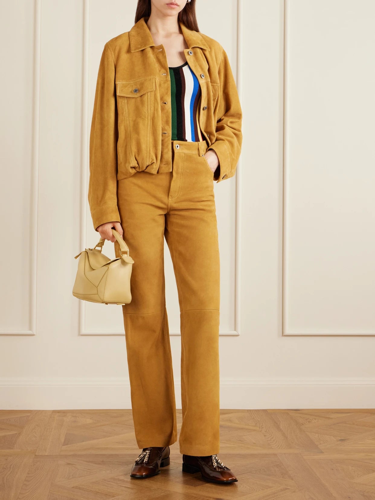 Image of a model wearing Pants. Product name - Suede High-rise Straight-leg Pants in Camel colour by brand - LOEWE