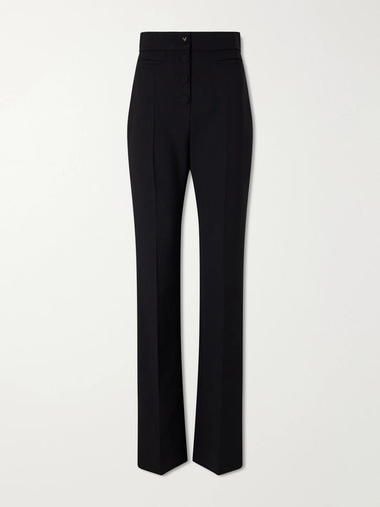 Image of a model wearing Pants. Product name - Straight-leg Wool Crepe Pants in Black colour by brand - Valentino Garavani