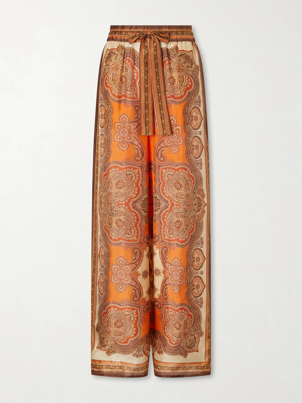 Image of a model wearing Pants. Product name - Mahon Printed Silk-satin Wide-leg Pants in Brown colour by brand - Zimmermann