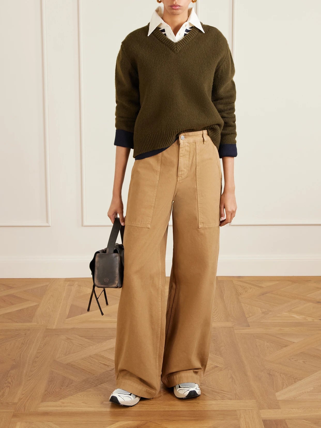 Image of a model wearing Pants. Product name - Wide-leg Cotton-canvas Trousers in Brown colour by brand - Moncler