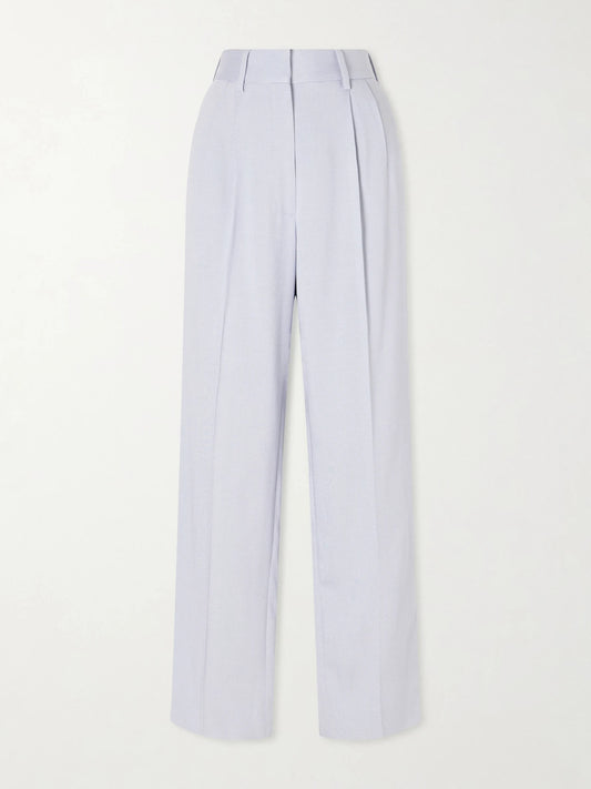 Image of a model wearing Pants. Product name - Vezon Pleated Tapered Woven Pants in Light blue colour by brand - BLAZÉ Milano