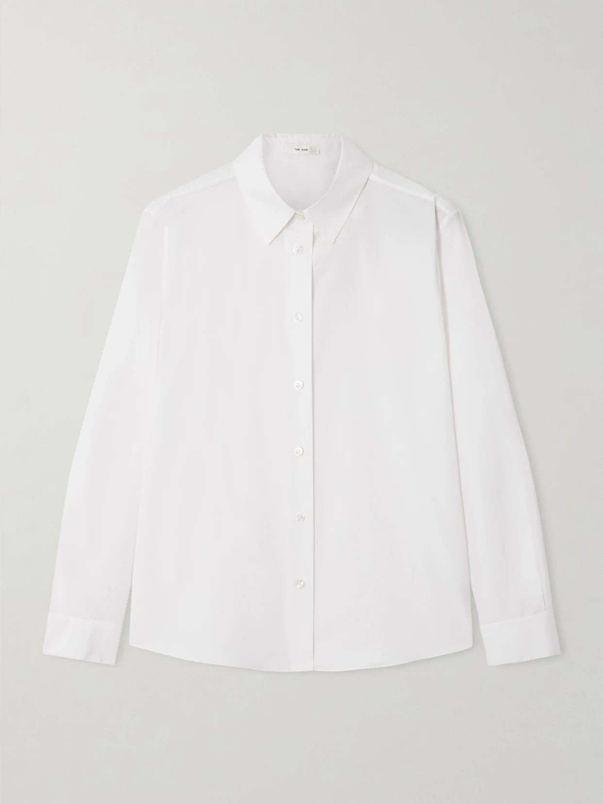 Image of a model wearing Tops. Product name - Sadie Cotton-poplin Shirt in White colour by brand - The Row