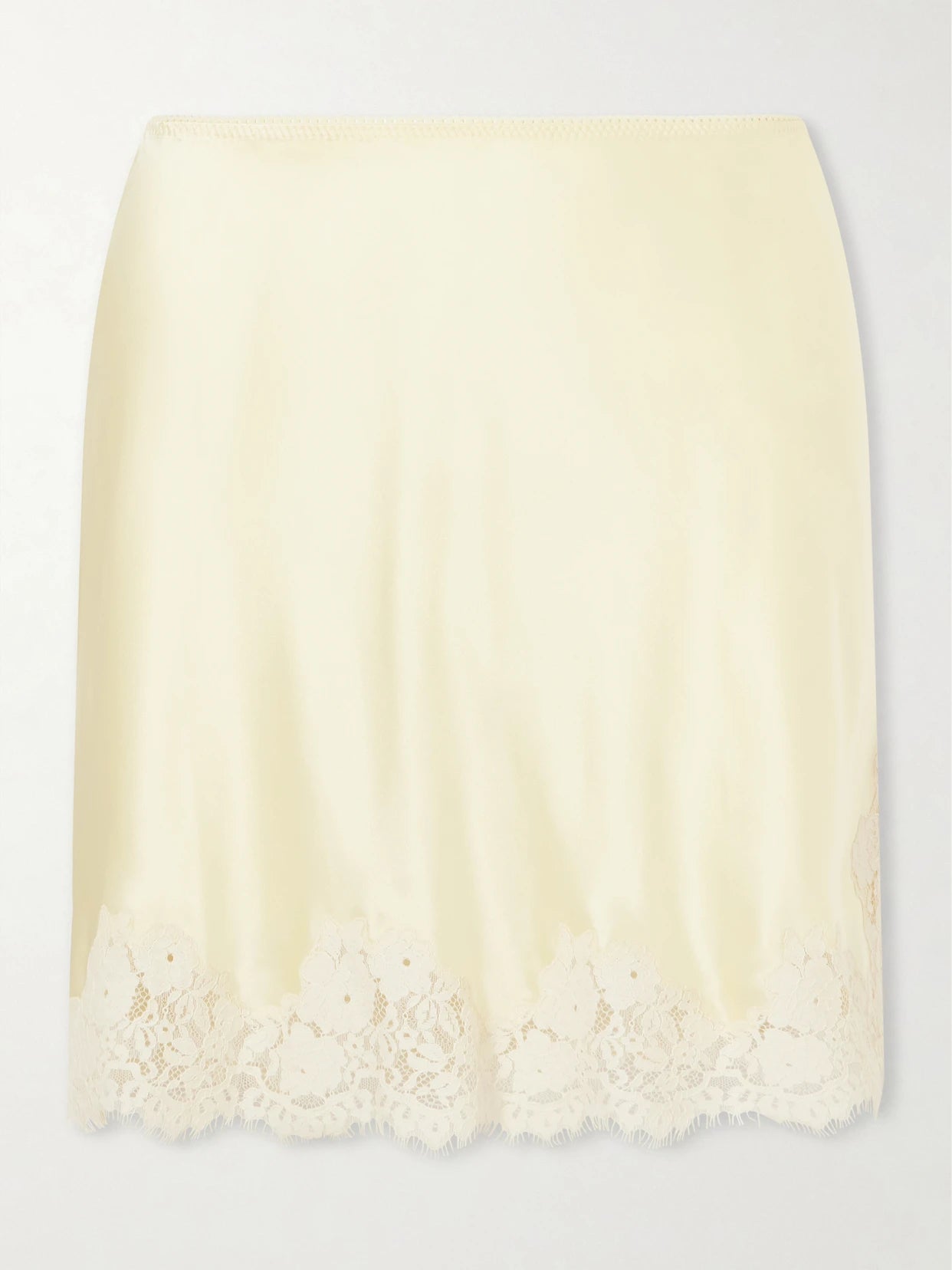 Image of a model wearing Skirts. Product name - Giulietta Lace-trimmed Silk-charmeuse Mini Skirt in Pastel yellow colour by brand - DÔEN