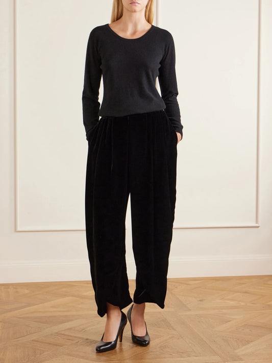 Image of a model wearing Pants. Product name - Velvet Tapered Pants in Blue colour by brand - The Row