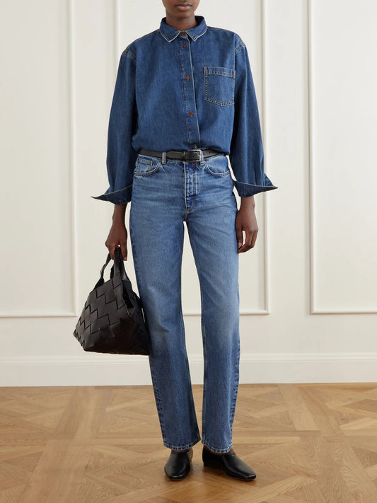 Image of a model wearing Tops. Product name - Edgar Organic Denim Shirt in Mid denim colour by brand - SKALL
