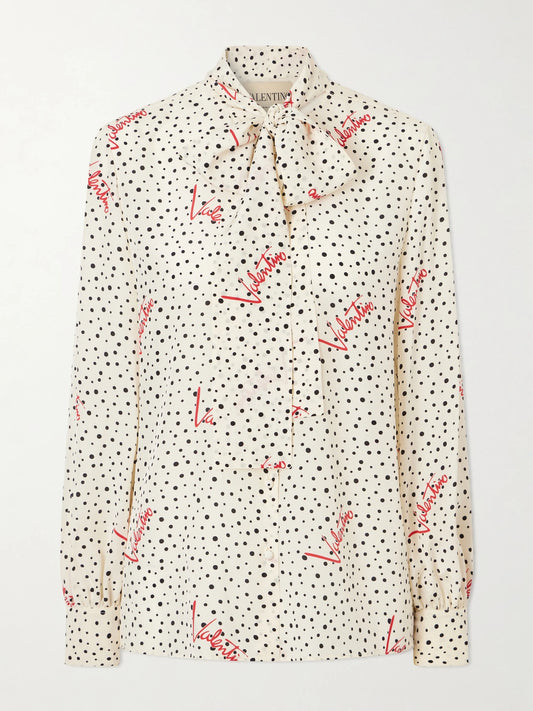 Image of a model wearing Tops. Product name - Pussy-bow Polka-dot Silk Crepe De Chine Blouse in Cream colour by brand - Valentino Garavani