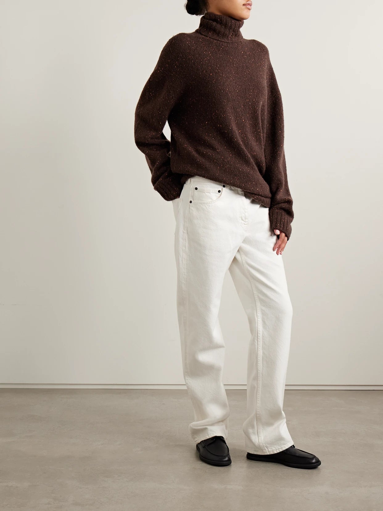 Image of a model wearing Outerwear. Product name - Mirai Cashmere Turtleneck Sweater in Burgundy colour by brand - The Row