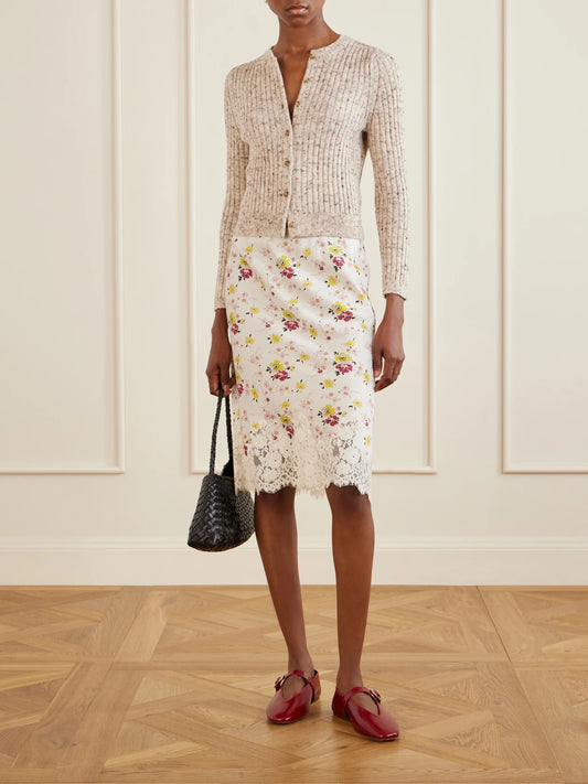 Image of a model wearing Skirts. Product name - Elowette Floral-print Lace-trimmed Silk-satin Knee-length Skirt in White colour by brand - DÔEN