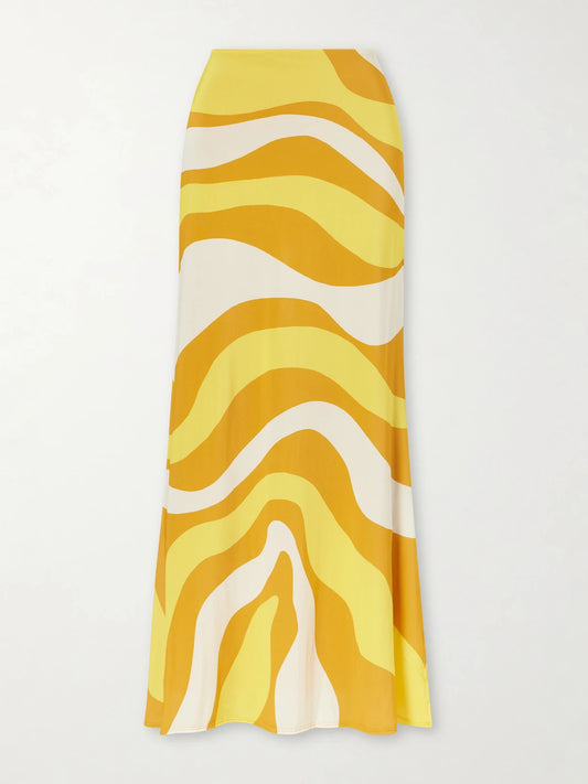 Image of a model wearing Skirts. Product name - Halia Printed Jersey Midi Skirt in Yellow colour by brand - Cala de la Cruz