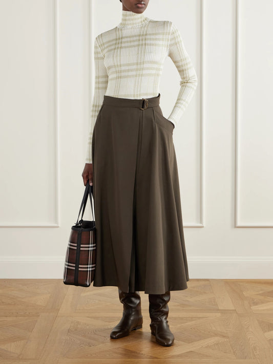 Image of a model wearing Outerwear. Product name - Genevia Checked Knitted Turtleneck Sweater in Beige colour by brand - Burberry