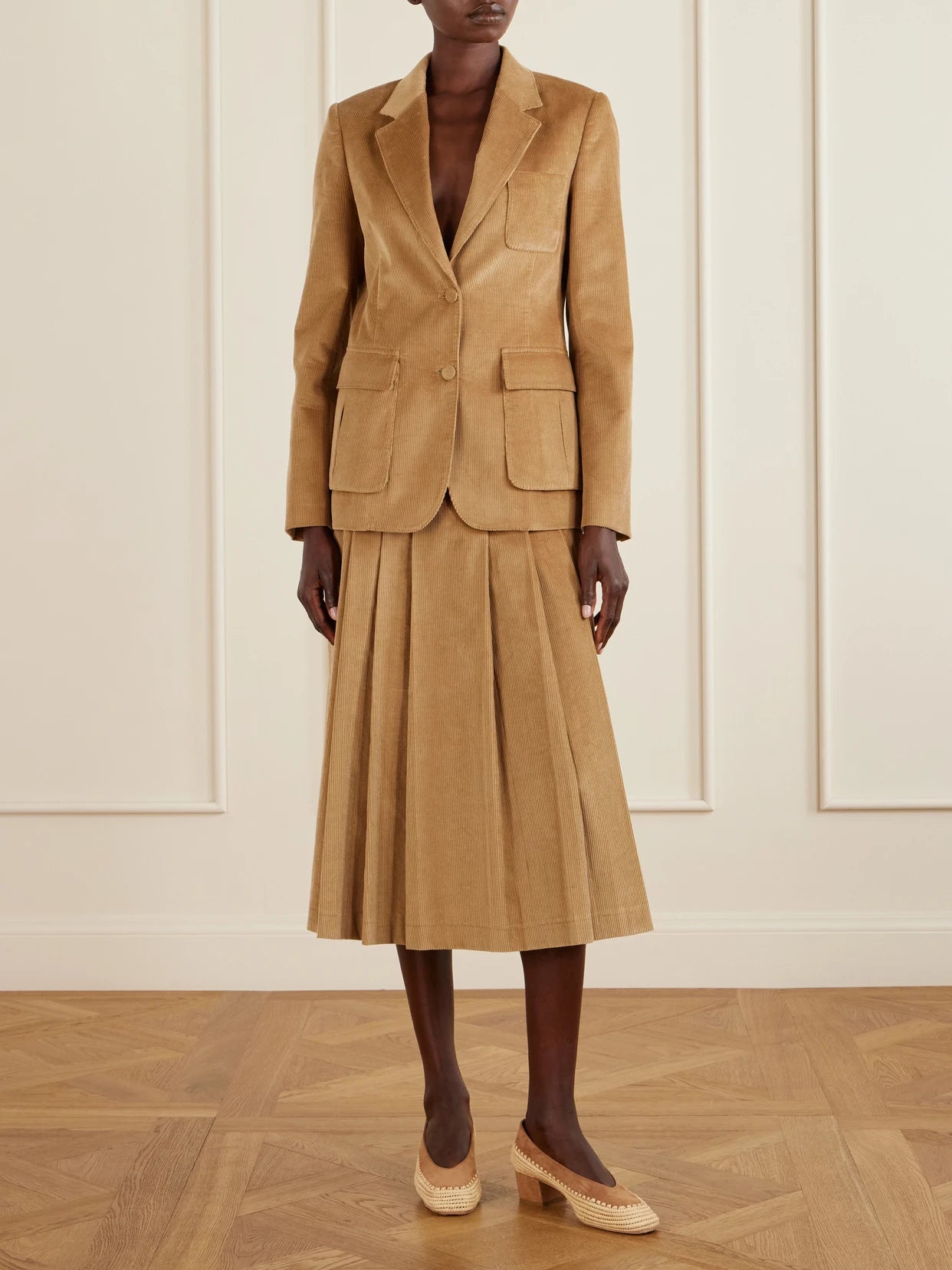 Image of a model wearing Skirts. Product name - Wesley Corduroy Cotton Maxi Skirt in Beige colour by brand - Gabriela Hearst