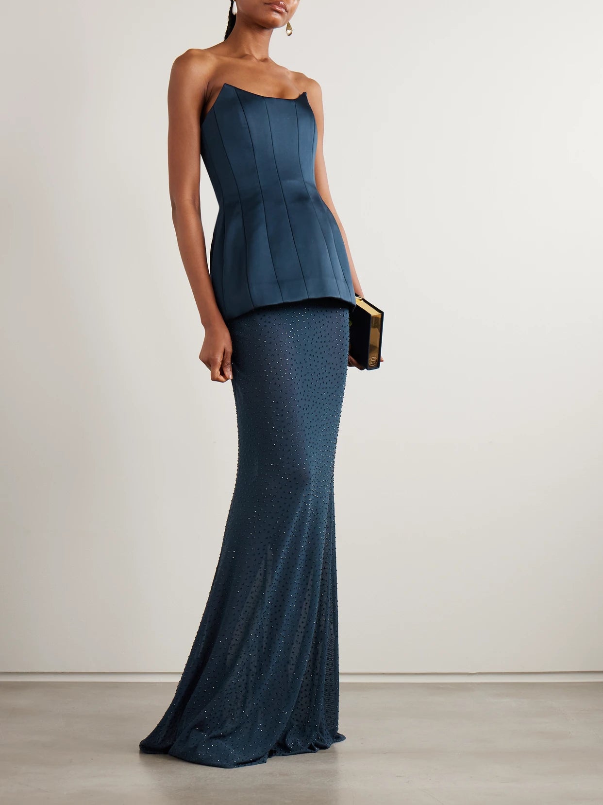 Image of a model wearing Skirts. Product name - Elivera Crystal-embellished Stretch-tulle Maxi Skirt in Navy colour by brand - Rebecca Vallance