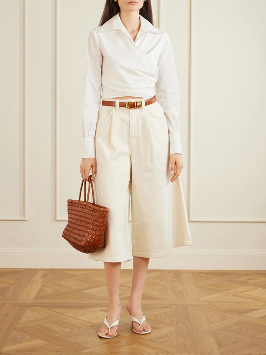 Image of a model wearing Shorts. Product name - 80's Gaucho Organic Cotton Shorts in Cream colour by brand - AGOLDE