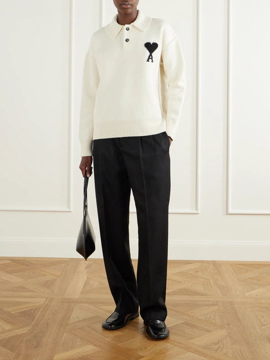 Image of a model wearing Outerwear. Product name - Intarsia Wool Polo Sweater in White colour by brand - AMI PARIS