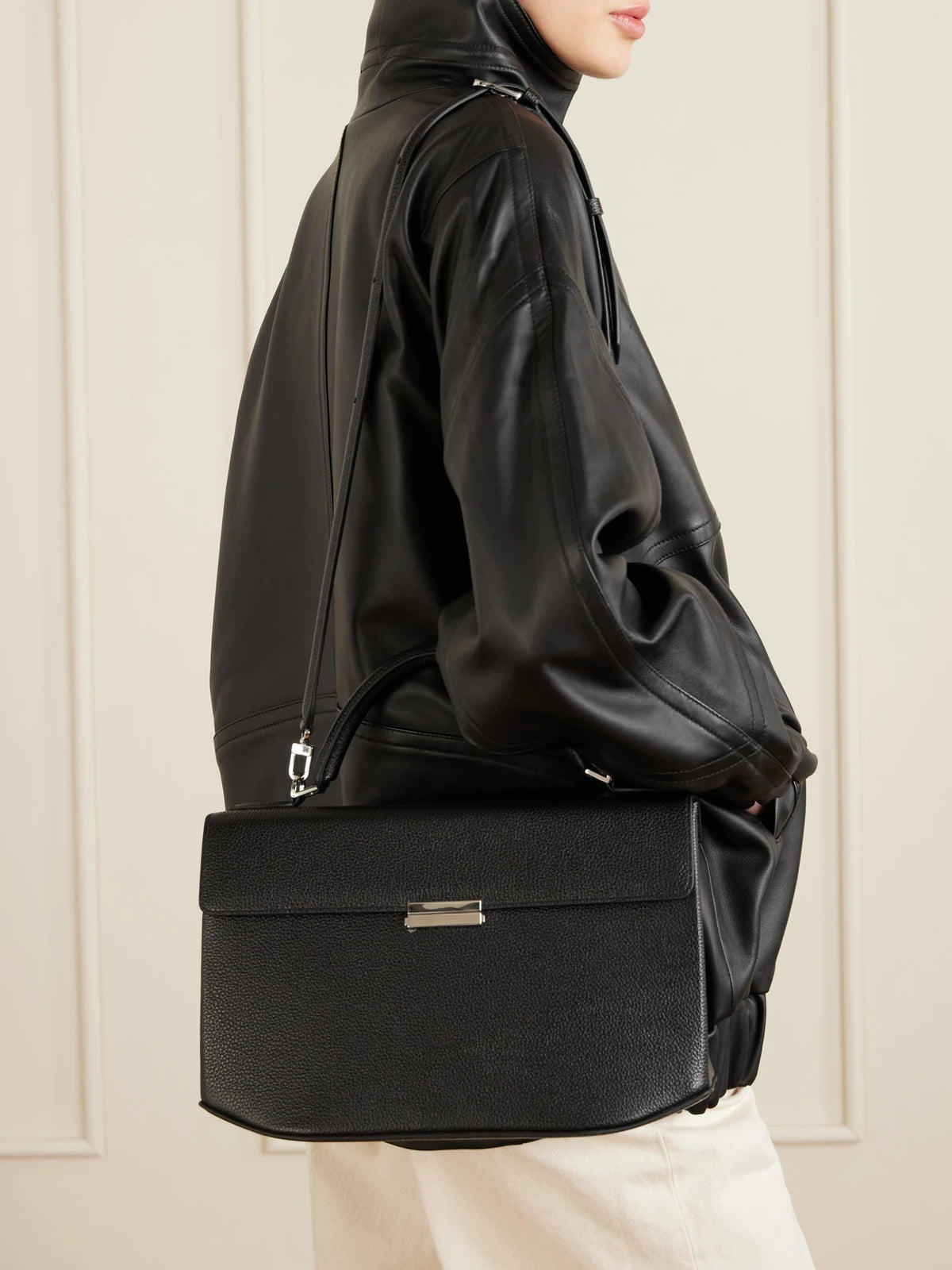 Image of Bags. Product name - Clip Textured-leather Shoulder Bag in Black colour by brand - TOTEME