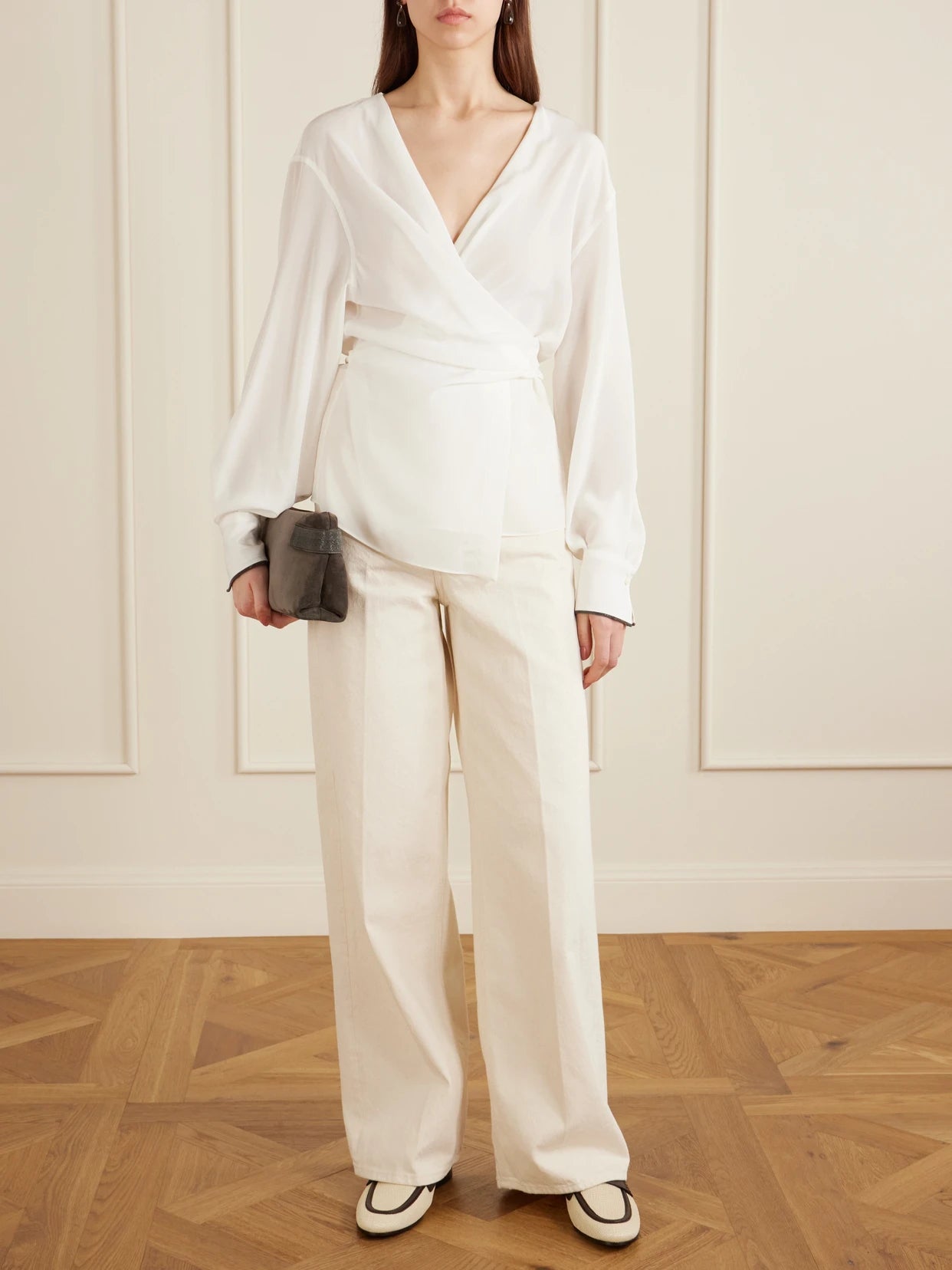 Image of a model wearing Tops. Product name - Wrap Silk Blouse in White colour by brand - Brunello Cucinelli