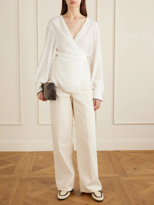 Image of a model wearing Tops. Product name - Wrap Silk Blouse in White colour by brand - Brunello Cucinelli