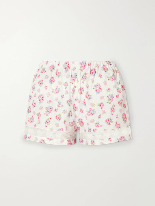Image of a model wearing Shorts. Product name - Rosita Lace-trimmed Floral-print Cotton Shorts in Pink colour by brand - Loretta Caponi