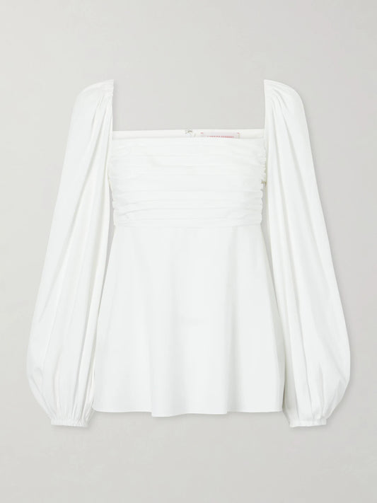 Image of a model wearing Tops. Product name - Cotton-blend Poplin Blouse in White colour by brand - Carolina Herrera