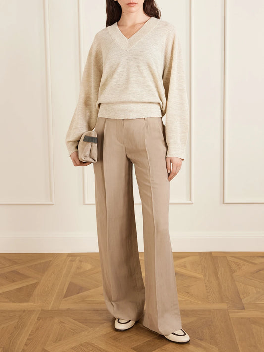 Image of a model wearing Outerwear. Product name - Knitted Sweater in Cream colour by brand - Brunello Cucinelli