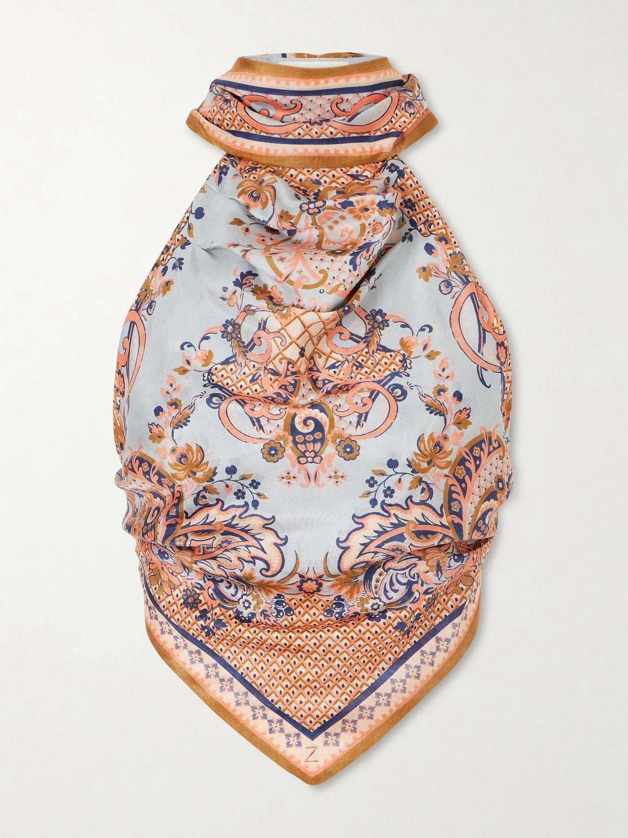 Image of a model wearing Tops. Product name - Aster Floral-print Silk-satin Halterneck Top in Blue colour by brand - Zimmermann