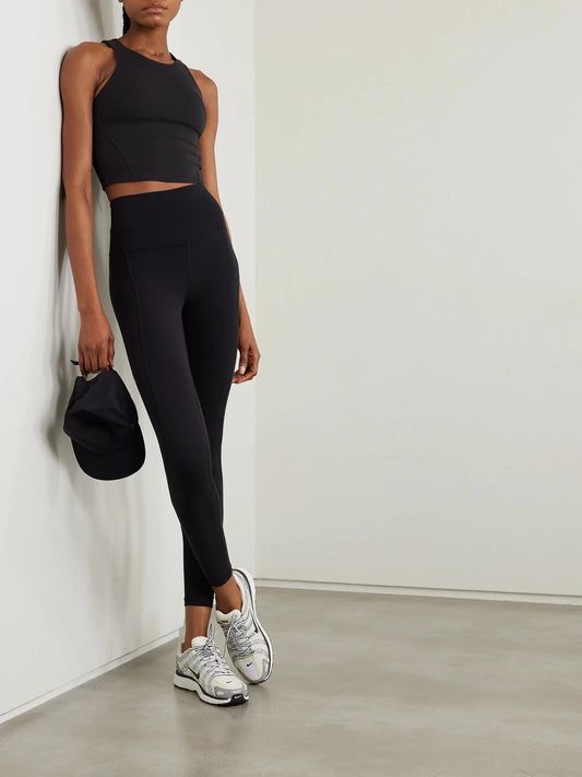 Image of a model wearing Tops. Product name - Wunder Train Everlux Tank in Black colour by brand - lululemon