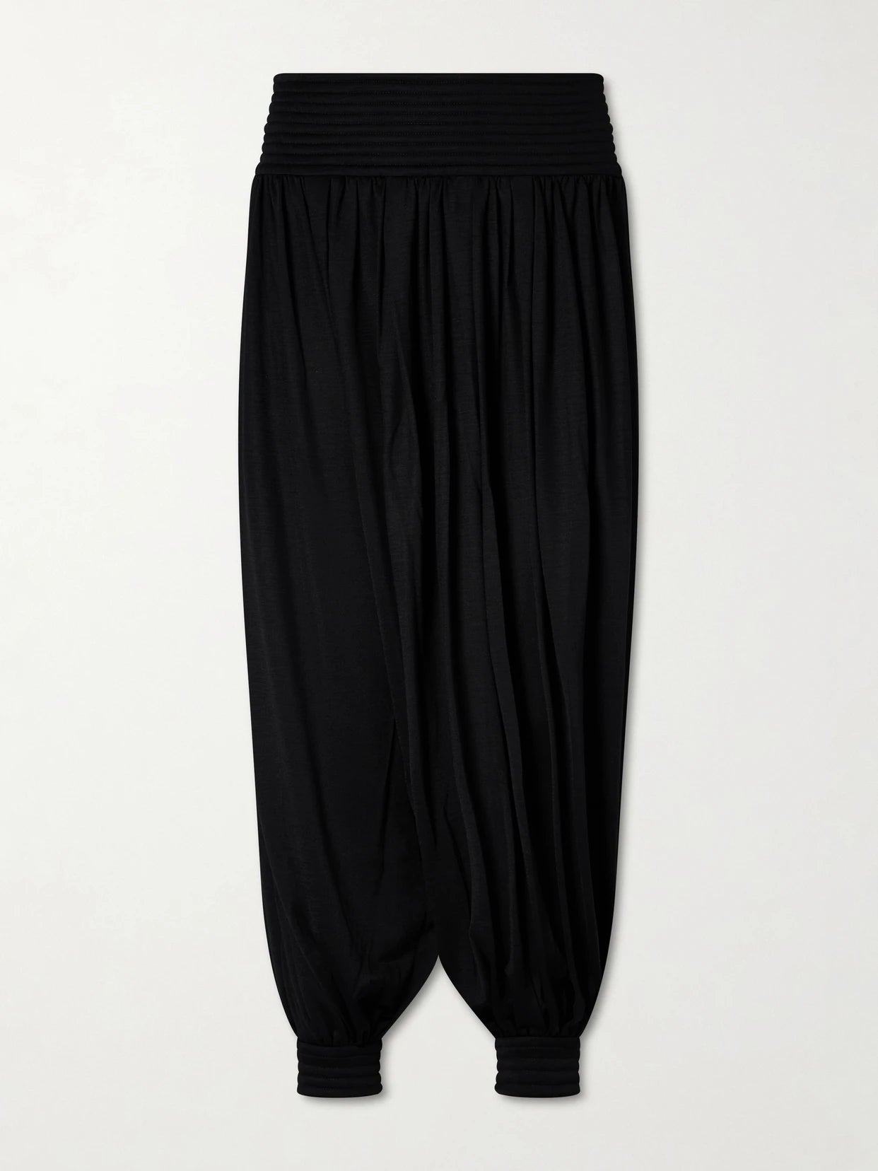 Image of a model wearing Pants. Product name - Wool-blend Balloon Pants in Black colour by brand - Alaïa