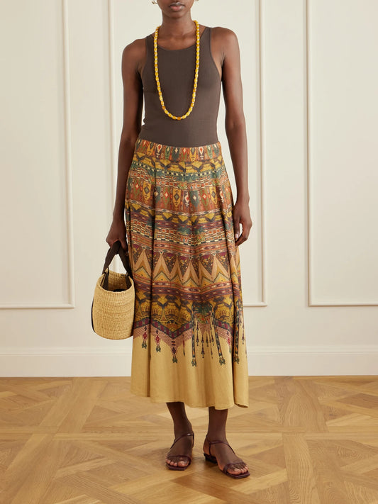 Image of a model wearing Skirts. Product name - Kendal Desert Printed Woven Silk-blend Maxi Skirt in Tan colour by brand - Emporio Sirenuse