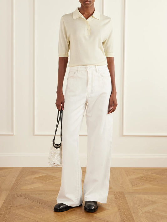 Image of a model wearing Outerwear. Product name - Ribbed Merino Wool And Silk-blend Polo Sweater in Cream colour by brand - Studio Nicholson