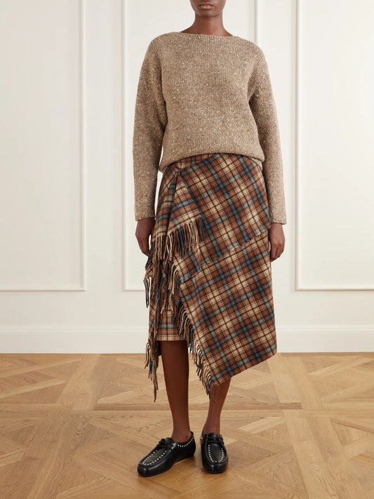 Image of a model wearing Outerwear. Product name - Wool Sweater in Brown colour by brand - Auralee