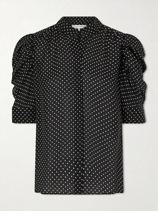 Image of a model wearing Tops. Product name - The Gillian Polka-dot Silk-voile Blouse in Black colour by brand - FRAME