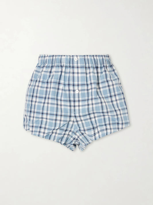 Image of a model wearing Shorts. Product name - Pebby Checked Cotton Shorts in Blue colour by brand - Acne Studios