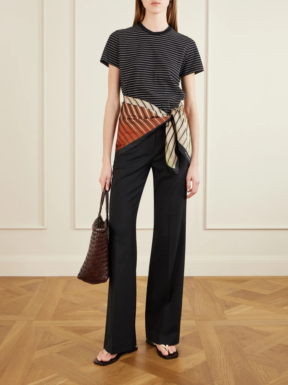 Image of a model wearing Tops. Product name - Kenzie Striped Cotton-jersey T-shirt in Black colour by brand - KALLMEYER