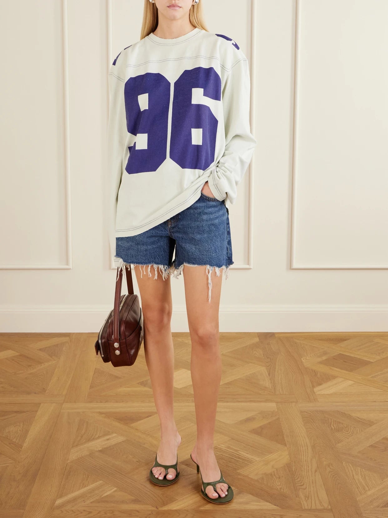 Image of a model wearing Tops. Product name - Printed Cotton-jersey Sweater in Off-white colour by brand - Acne Studios
