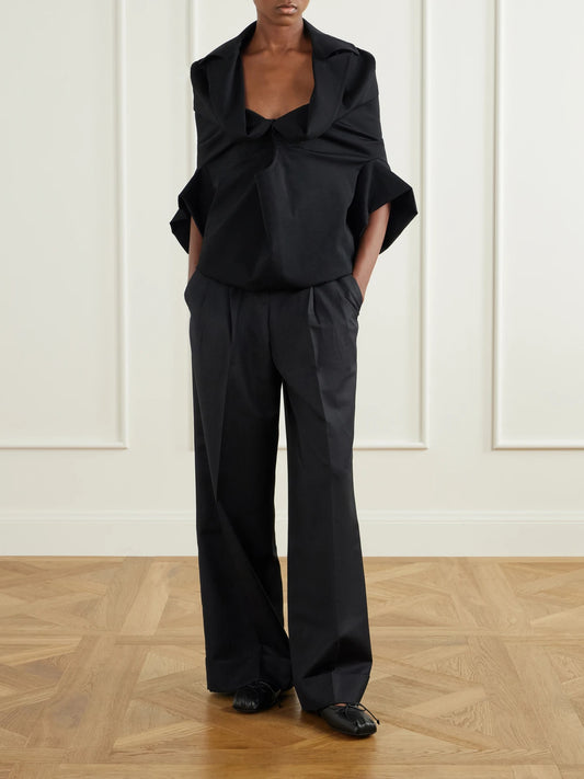 Image of a model wearing Tops. Product name - Wool-blend Blouse in Black colour by brand - Junya Watanabe