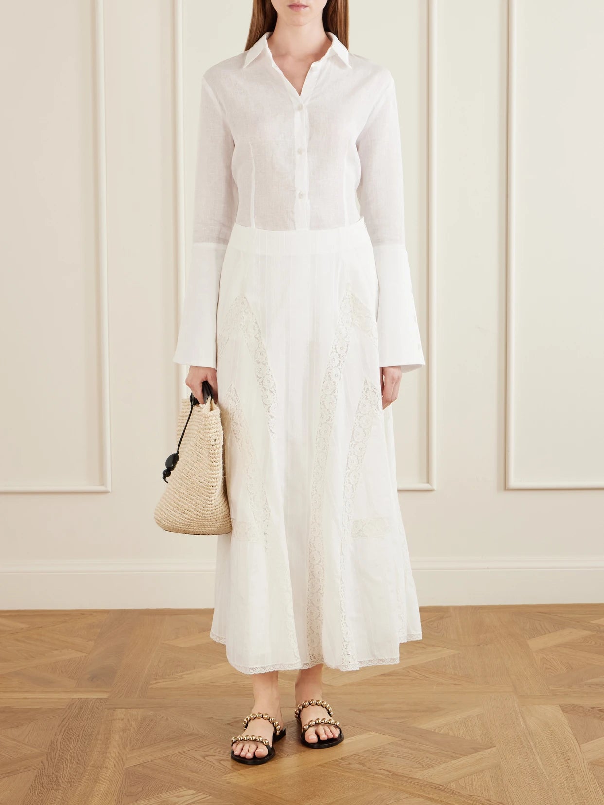 Image of a model wearing Skirts. Product name - Vieste Lace-trimmed Cotton-muslin Maxi Skirt in Off-white colour by brand - Loretta Caponi