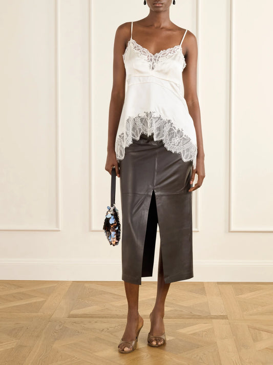 Image of a model wearing Tops. Product name - Lina Lace-trimmed Silk-blend Tank in Ivory colour by brand - STAUD