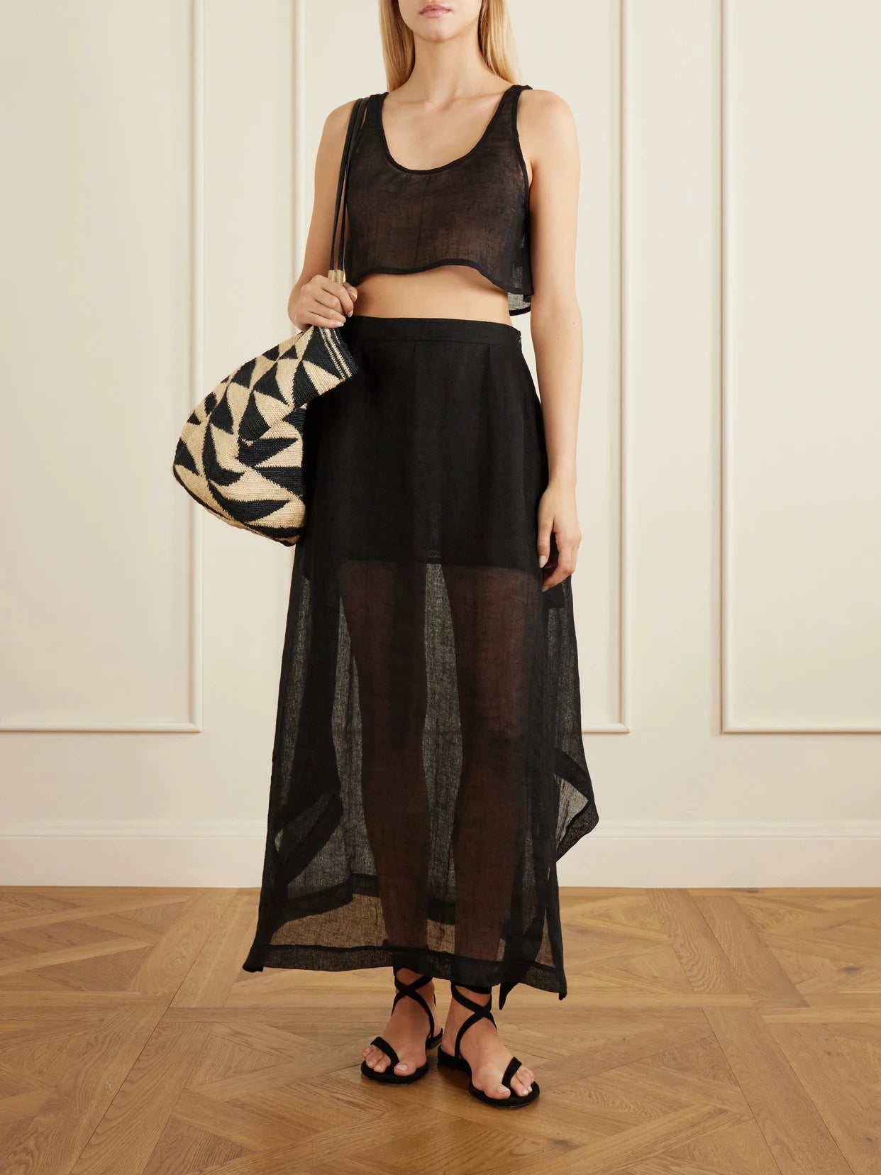 Image of a model wearing Tops. Product name - Tahta Cropped Linen Top in Black colour by brand - Le Kasha