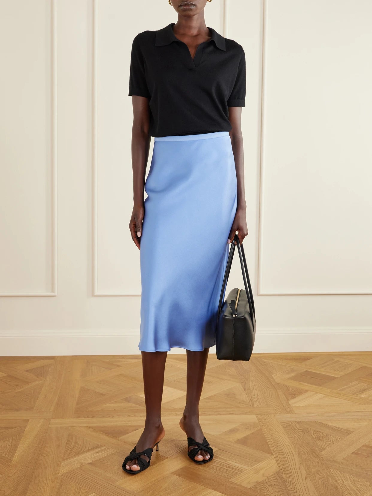Image of a model wearing Skirts. Product name - Bar Silk-charmeuse Maxi Skirt in Blue colour by brand - Anine Bing