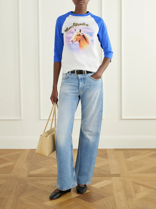 Image of a model wearing Tops. Product name - Printed Cotton T-shirt in White colour by brand - Stella McCartney